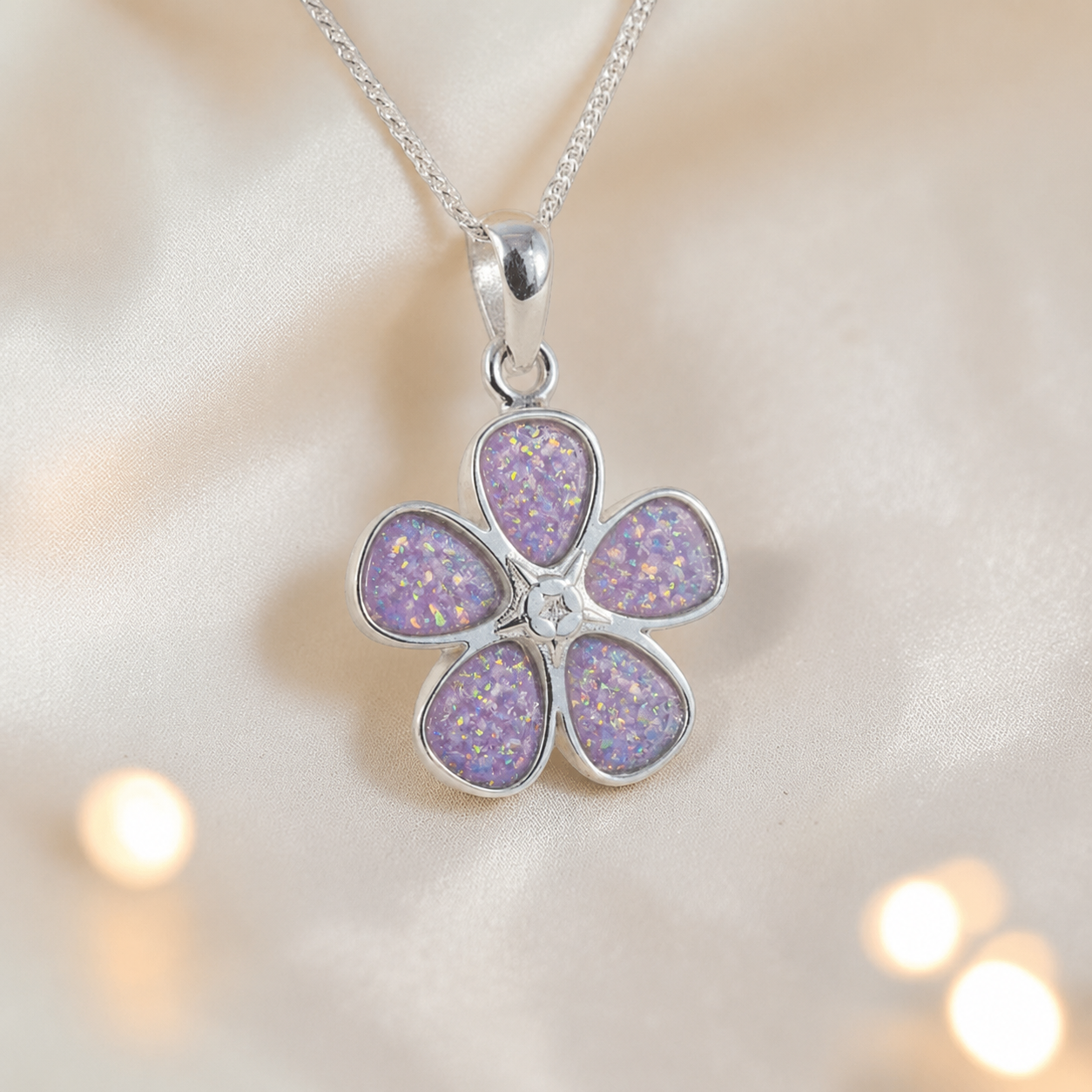 Arctura flower shaped ashes pendant in unicorn purple, handcrafted in Lancashire UK