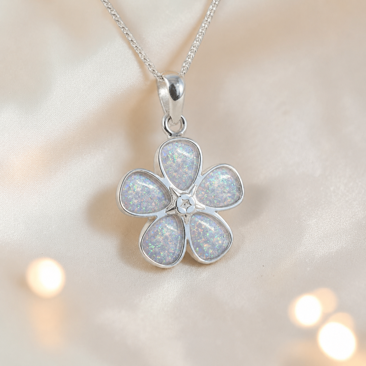 Arctura flower shaped ashes pendant in white snow, handcrafted in Lancashire UK