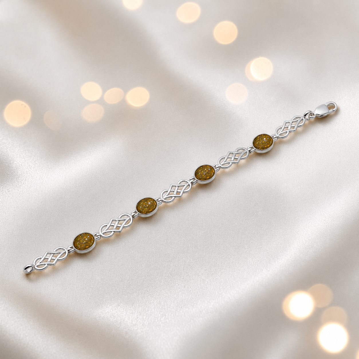 Asteria Bracelet — silver Celtic-style ashes memorial bracelet in gold olive, handcrafted in Lancashire, UK