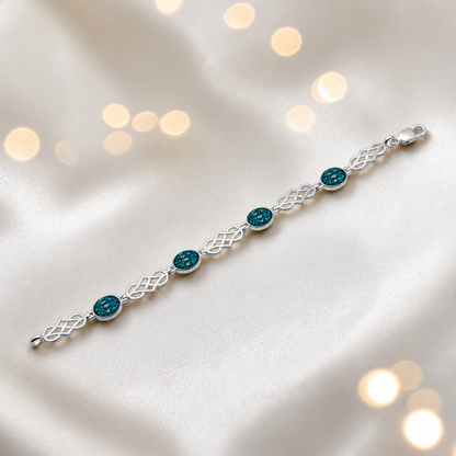 Asteria Bracelet — silver Celtic-style ashes memorial bracelet in teal mist, handcrafted in Lancashire, UK