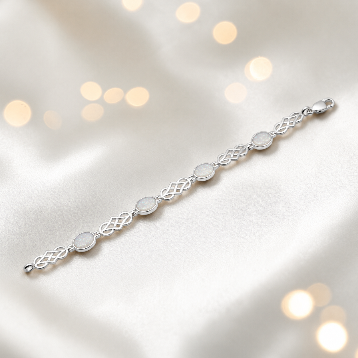 Asteria Bracelet — silver Celtic-style ashes memorial bracelet in white snow, handcrafted in Lancashire, UK