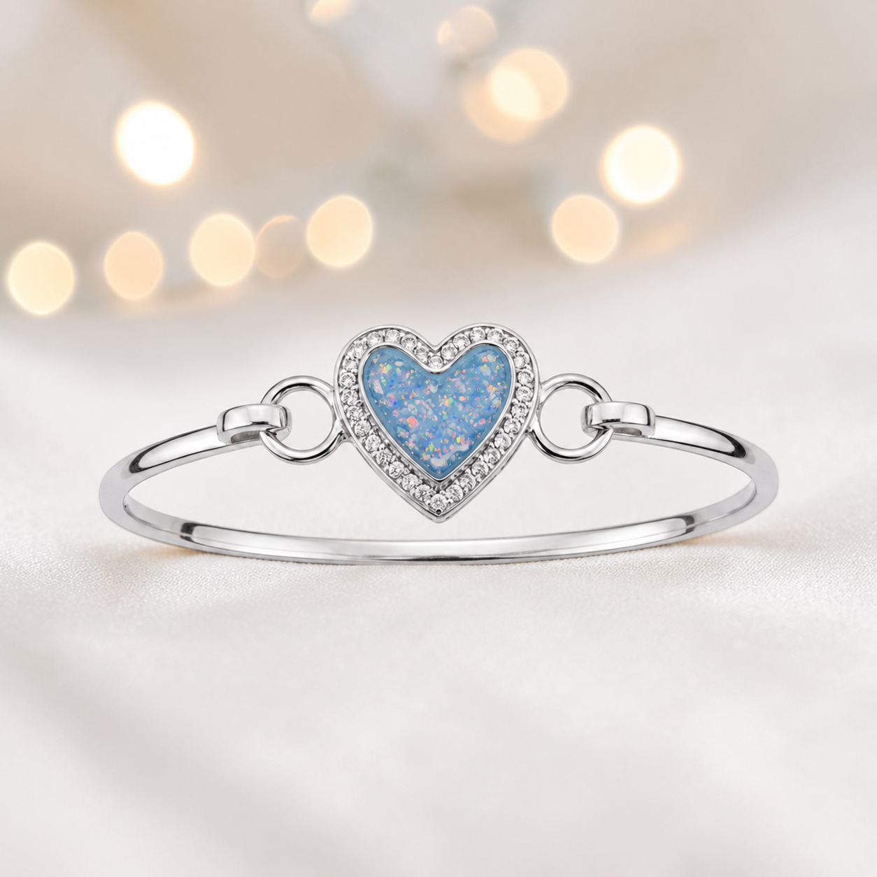 Auriga Heart Bangle — silver heart ashes memorial CZ bangle in baby blue, handcrafted in Lancashire, UK - by Keepsake Memorial Jeweller