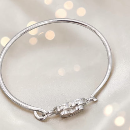 Auriga Heart Bangle — silver heart ashes memorial CZ bangle, tope view, handcrafted in Lancashire, UK - by Keepsake Memorial Jeweller