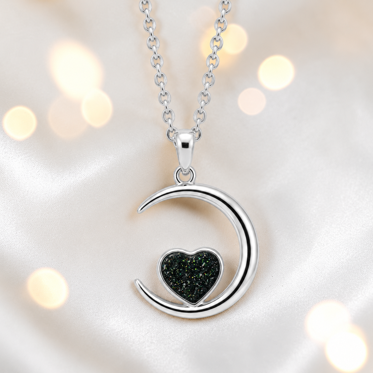 Aveline heart moon ashes pendant in black flame, handcrafted in Lancashire UK