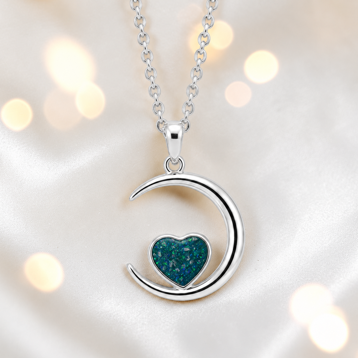 Aveline heart moon ashes pendant in teal mist, handcrafted in Lancashire UK
