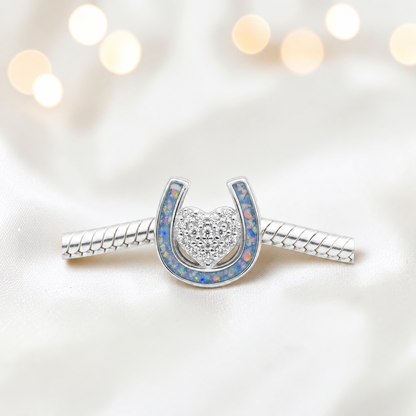 Bella horse shoe ashes charm with CZ heart,  in baby blue, handmade in Lancashire UK - by Keepsake Memorial Jewellery