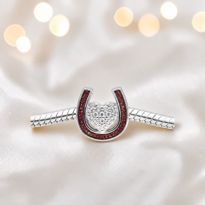 Bella horse shoe ashes charm with CZ heart, in ruby red, handmade in Lancashire UK - by Keepsake Memorial Jewellery