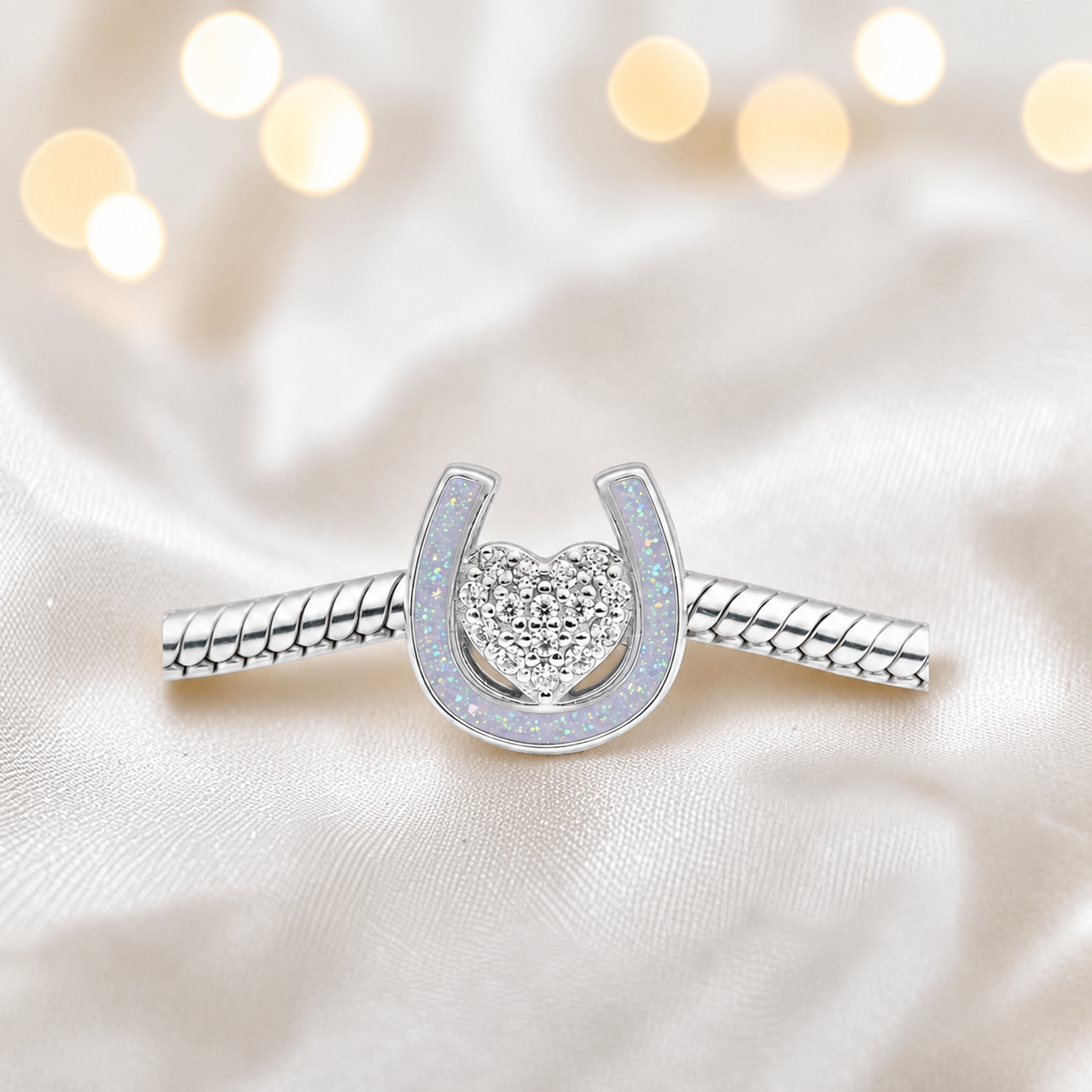 Bella horse shoe ashes charm with CZ heart, in white snow, handmade in Lancashire UK - by Keepsake Memorial Jewellery
