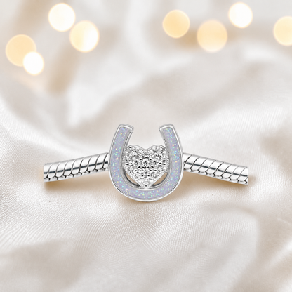 Bella horse shoe ashes charm with CZ heart, in white snow, handmade in Lancashire UK - by Keepsake Memorial Jewellery
