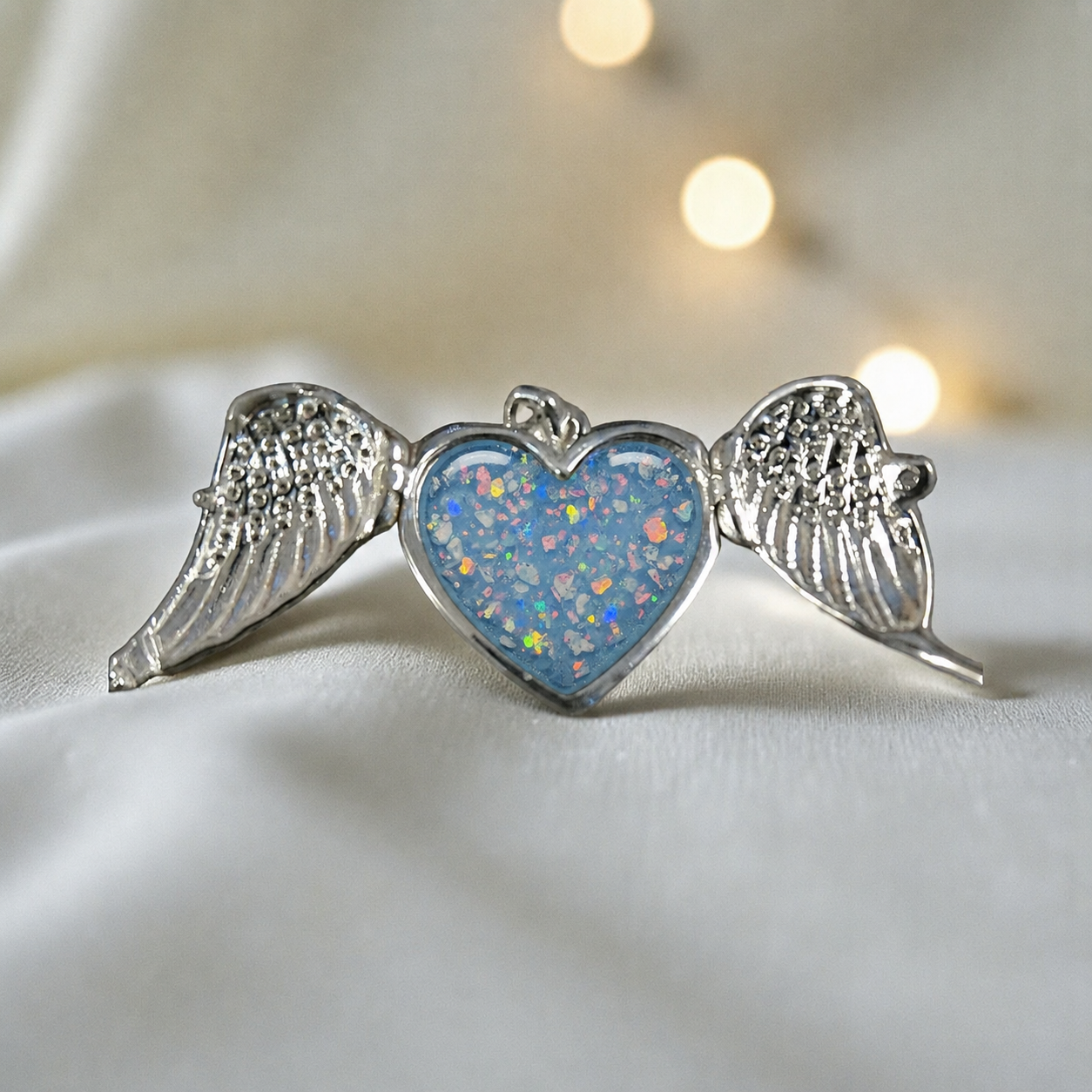 Canopus angel wing memorial pendant in baby blue, handcrafted in Lancashire UK - by Keepsake Memorial Jewellery