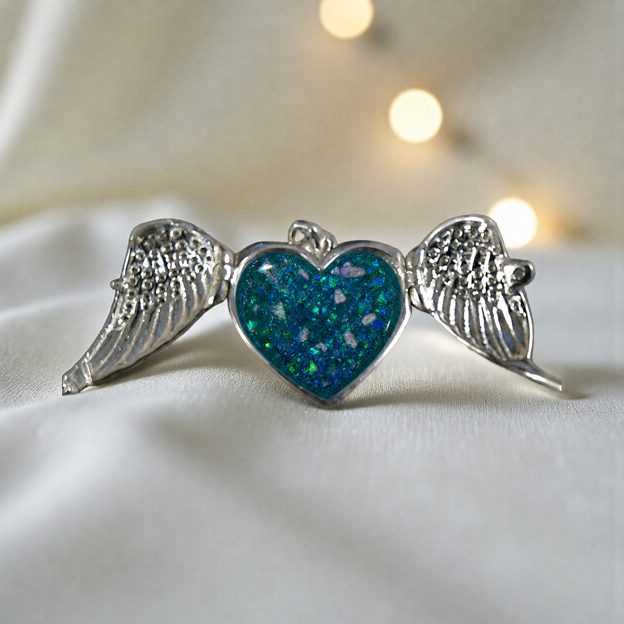 Canopus angel wing memorial pendant in teal mist, handcrafted in Lancashire UK - by Keepsake Memorial Jewellery