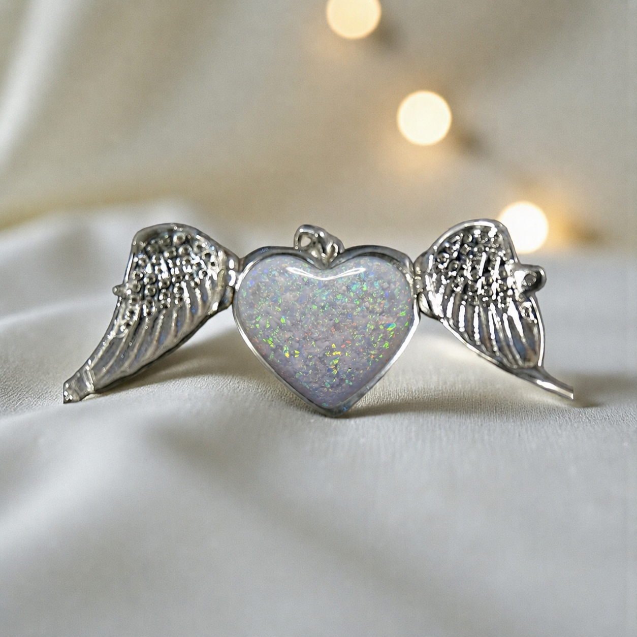Canopus angel wing memorial pendant in white snow, handcrafted in Lancashire UK - by Keepsake Memorial Jewellery