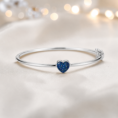 Cassia Heart Bangle — silver heart ashes memorial bangle in sapphire glow, handcrafted in Lancashire, UK - by Keepsake Memorial Jewellery