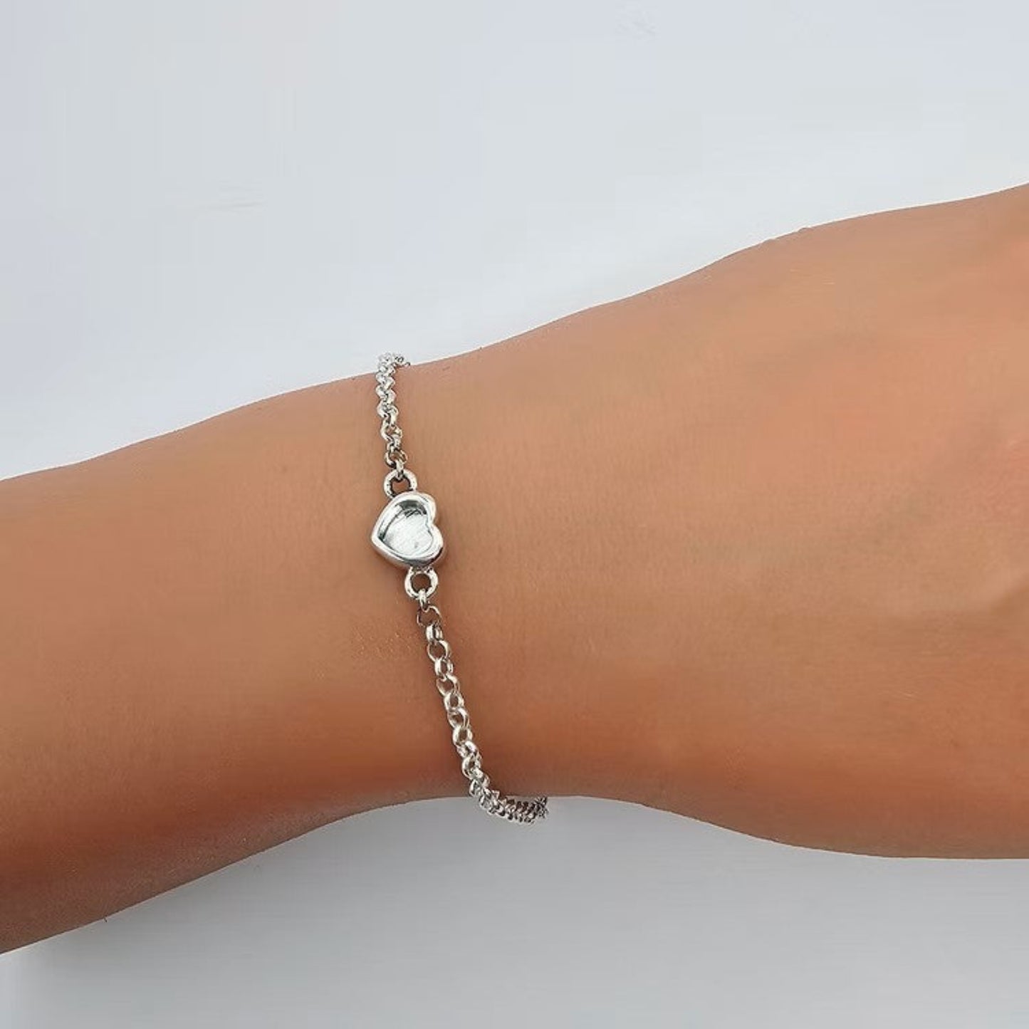 Cassia Bracelet — silver heart ashes memorial bracelet worn on wrist, handcrafted in Lancashire, UK