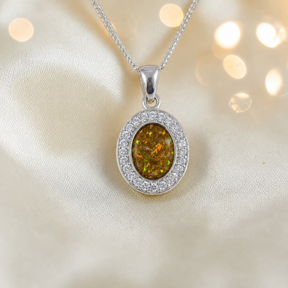 Celae oval ashes pendant in gold olive, handcrafted in Lancashire UK