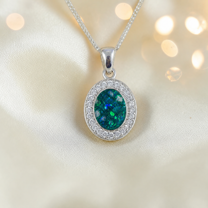 Celae oval ashes pendant in teal mist, handcrafted in Lancashire UK
