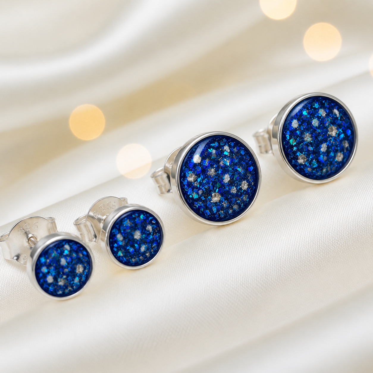 Radiance Earrings — silver round ashes memorial stud earrings in Sapphire Glow resin, handcrafted in Lancashire, UK