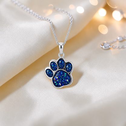 Daisy Pendant - silver dog paw memorial ashes pendant in sapphire glow, handcrafted in Lancashire UK - Keepsake Memorial Jewellery