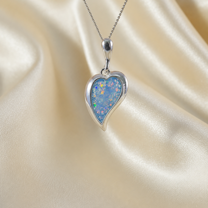 Deneb curved heart silver ashes pendant in baby blue, handcrafted in Lancashire UK