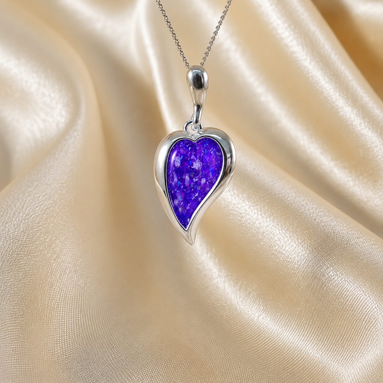 Deneb curved heart silver ashes pendant in sleepy lavender, handcrafted in Lancashire UK