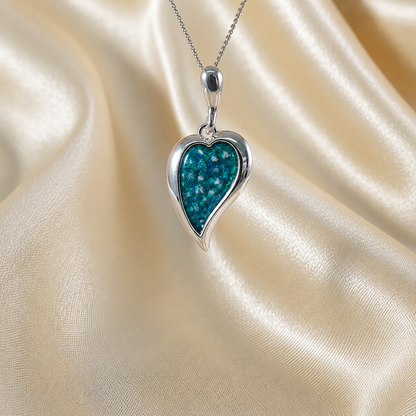 Deneb curved heart silver ashes pendant in teal mist, handcrafted in Lancashire UK