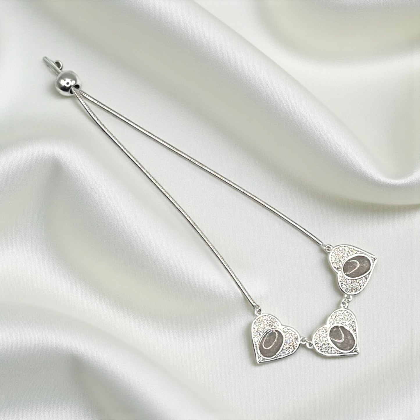 Elara Bracelet — silver three heart ashes memorial bracelet, handcrafted in Lancashire, UK - by Keepsake Memorial Jewellery