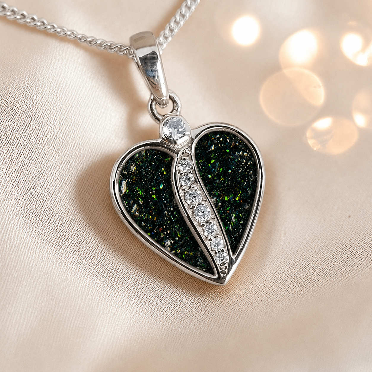 Elara Split heart shaped ashes pendant with CZ in black flame, handcrafted in Lancashire UK