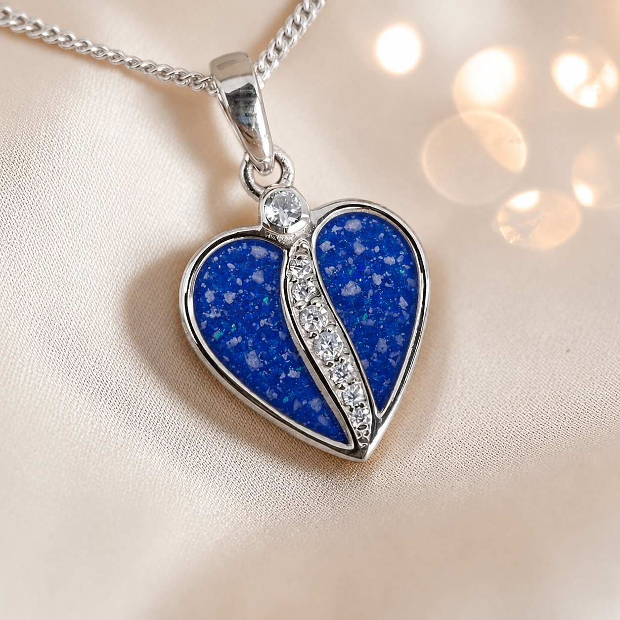 Elara Split heart shaped ashes pendant with CZ in royal blue, handcrafted in Lancashire UK