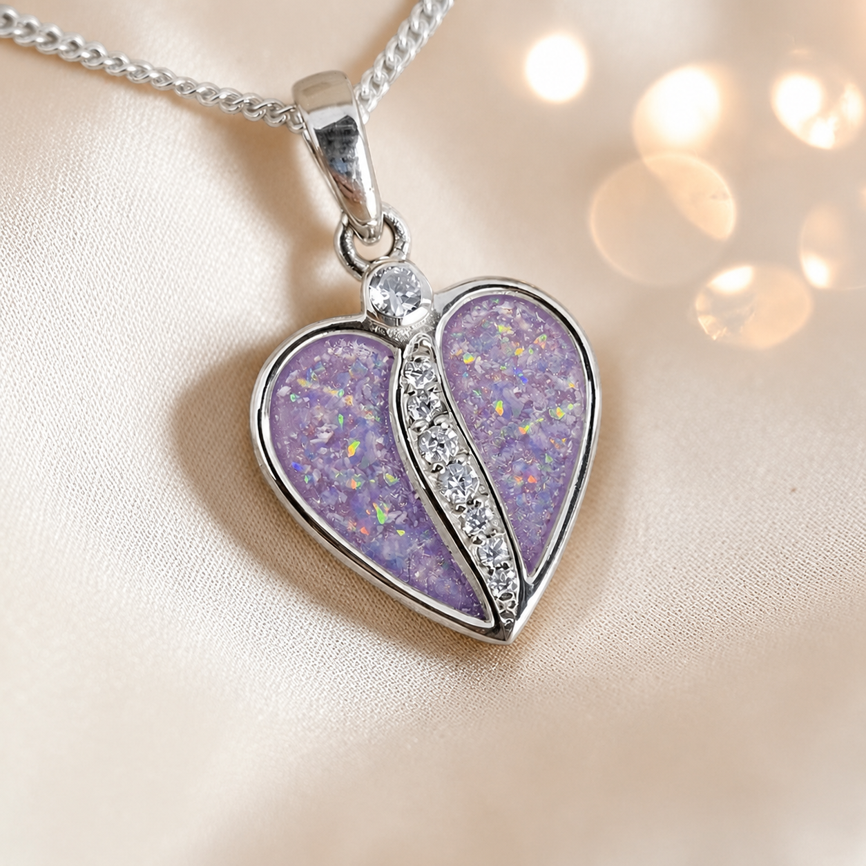 Elara Split heart shaped ashes pendant with CZ in unicorn purple, handcrafted in Lancashire UK