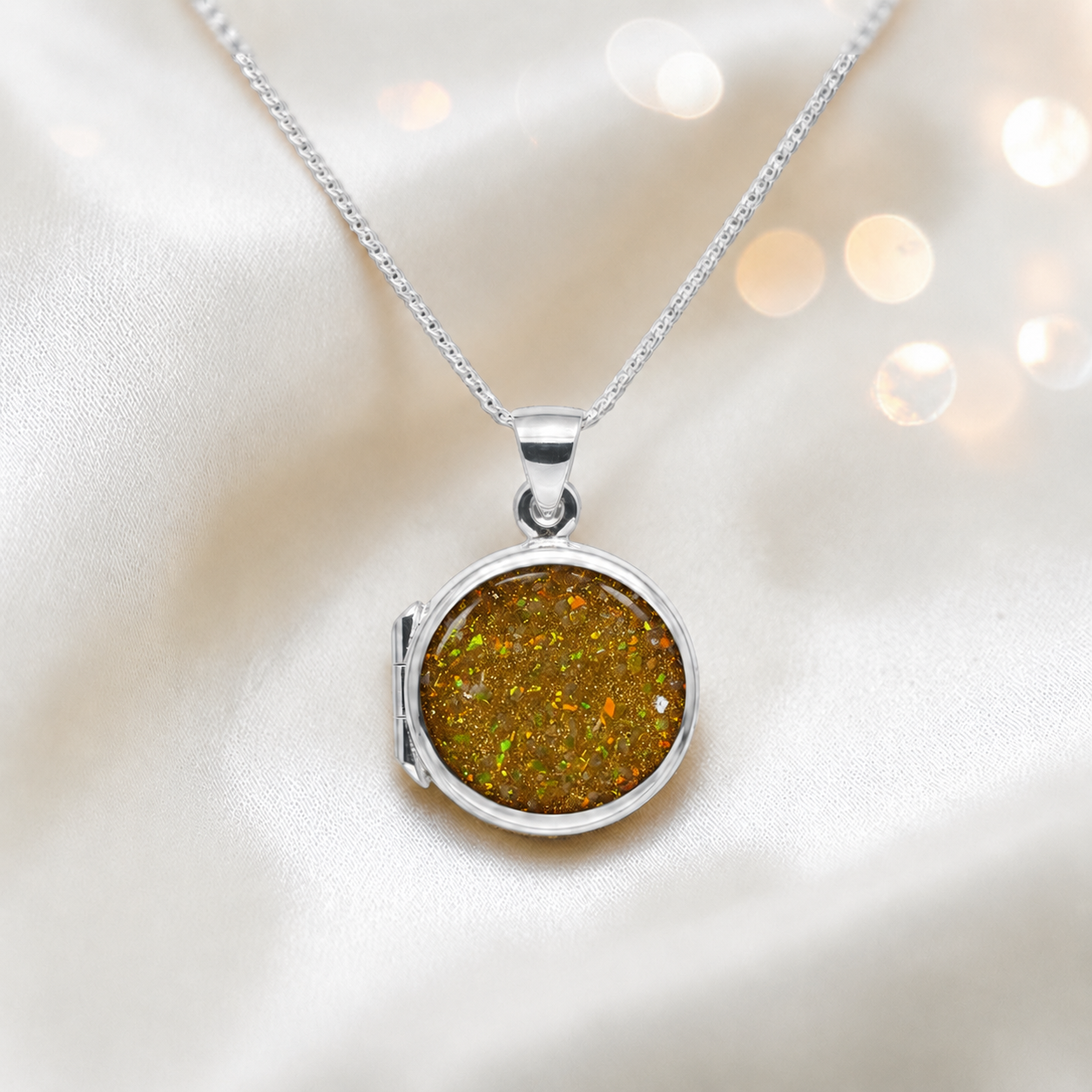Electra round memorial locket in sterling silver, shown here in gold olive, handcrafted in Lancashire UK - by Keepsake Memorial Jewellery