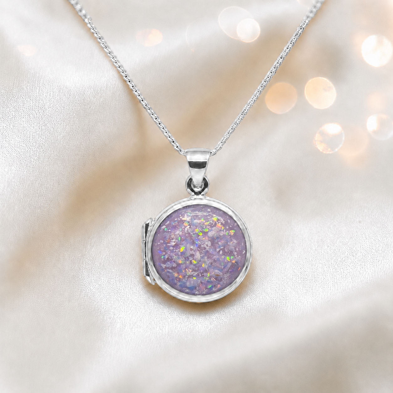 Electra round memorial locket in sterling silver, shown here in unicorn purple, handcrafted in Lancashire UK - by Keepsake Memorial Jewellery