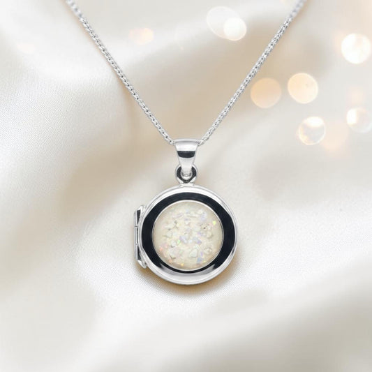 Electra round memorial locket in sterling silver, shown here in white snow, handcrafted in Lancashire UK - by Keepsake Memorial Jewellery