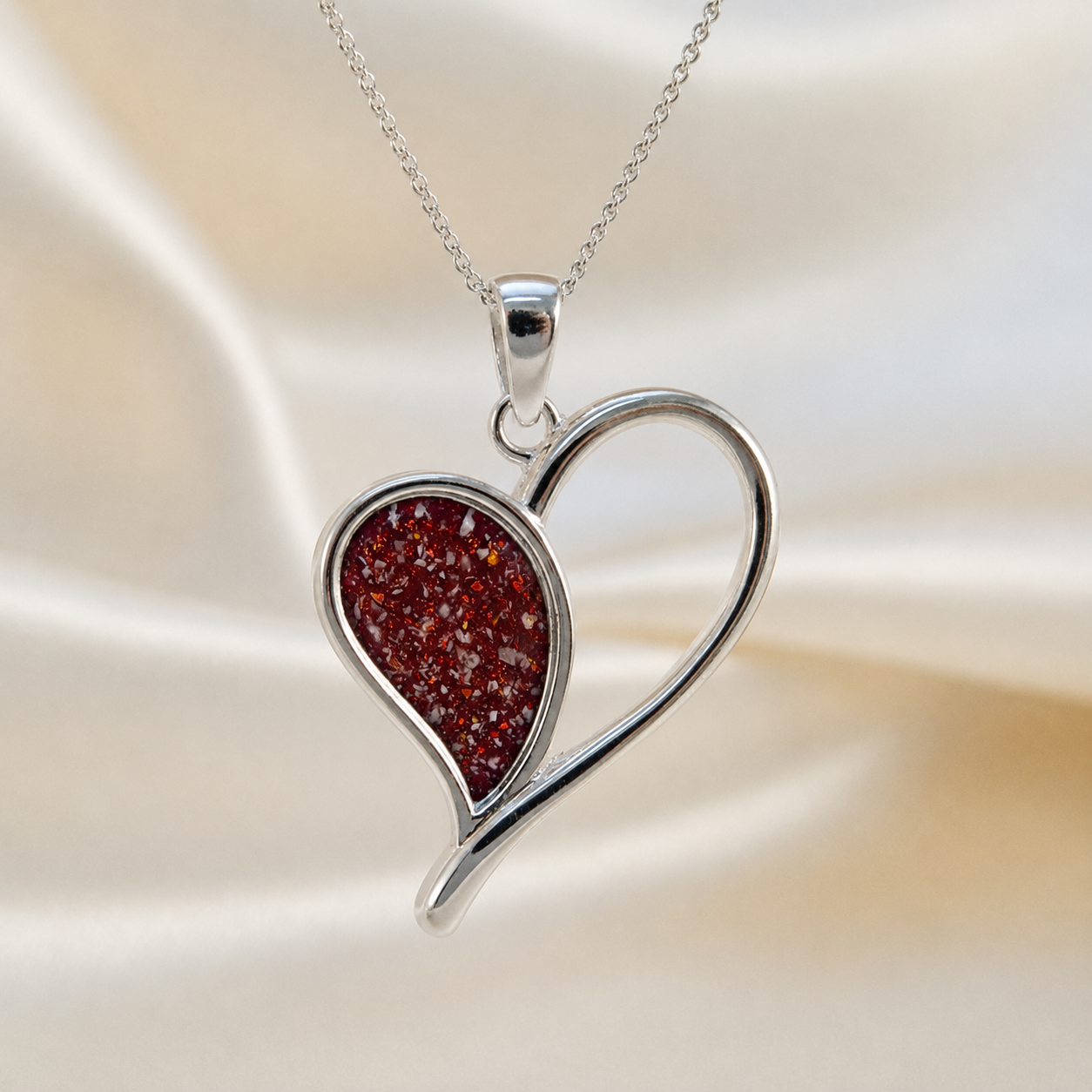 Elnath heart ashes pendant in ruby red, handcrafted in Lancashire UK