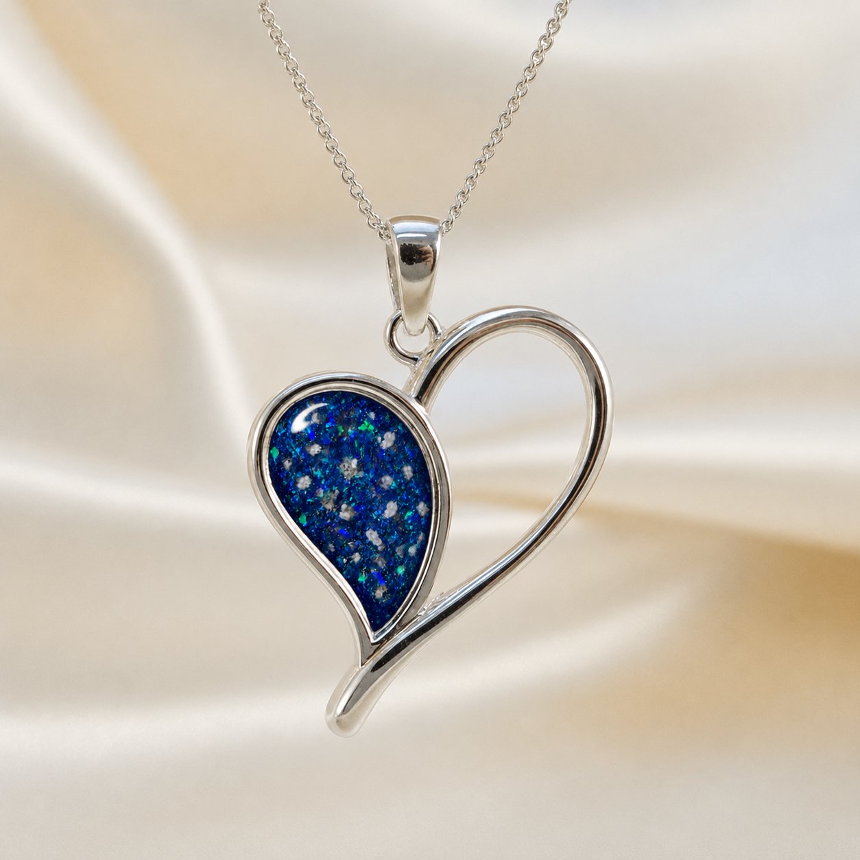 Elnath heart ashes pendant in sapphire glow, handcrafted in Lancashire UK