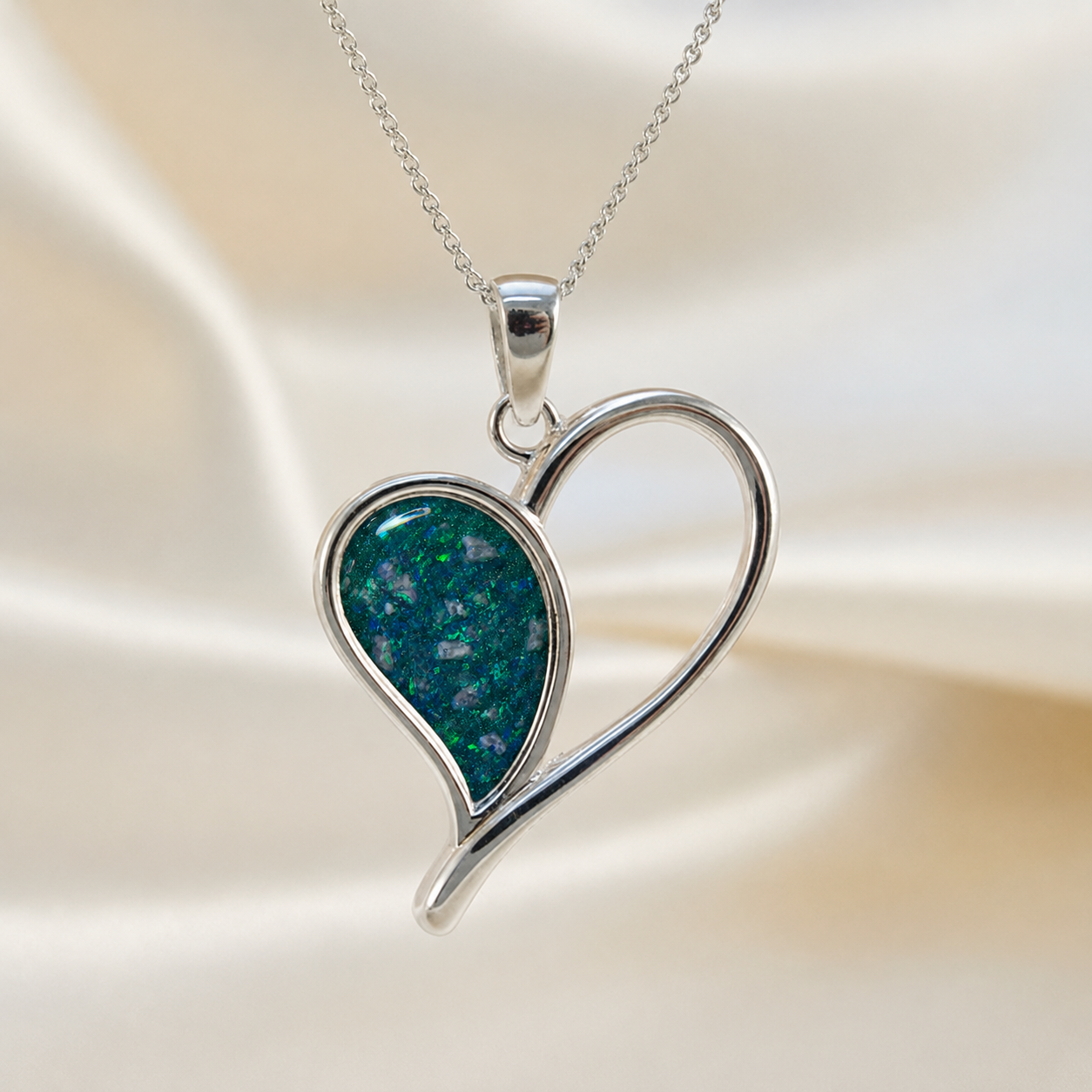 Elnath heart ashes pendant in teal mist, handcrafted in Lancashire UK
