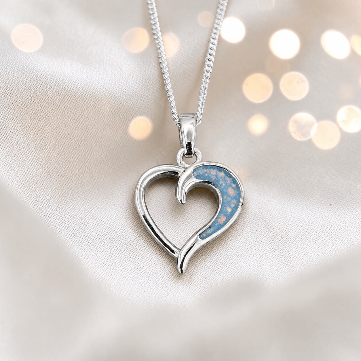 Enif Heart Ashes Pendant with baby blue in single side recess, handcrafted in Lancashire, uk