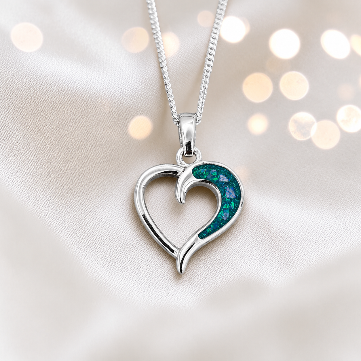 Enif Heart Ashes Pendant with teal mist in single side recess, handcrafted in Lancashire UK