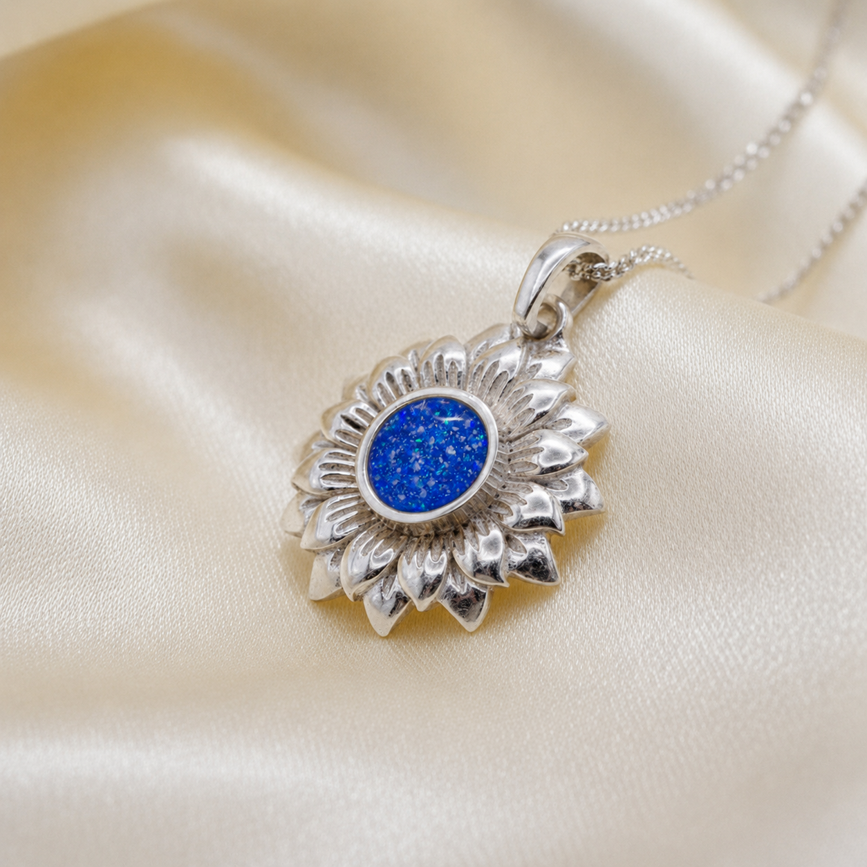 Flora sunflower silver ashes pendant in royal blue, handcrafted in Lancashire UK