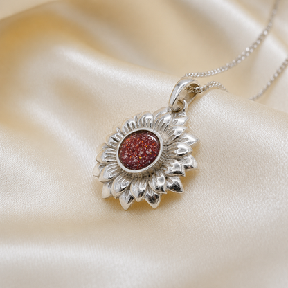Flora sunflower silver ashes pendant in ruby red, handcrafted in Lancashire UK