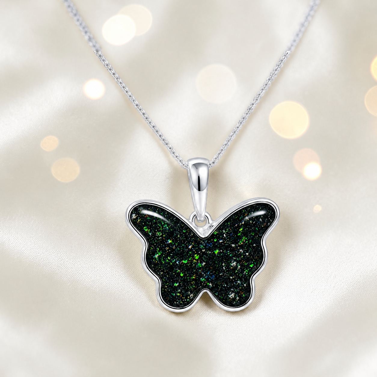 Foma butterfly memorial pendant in black flame, handcrafted in Lancashire UK - by Keepsake Memorial Jewellery