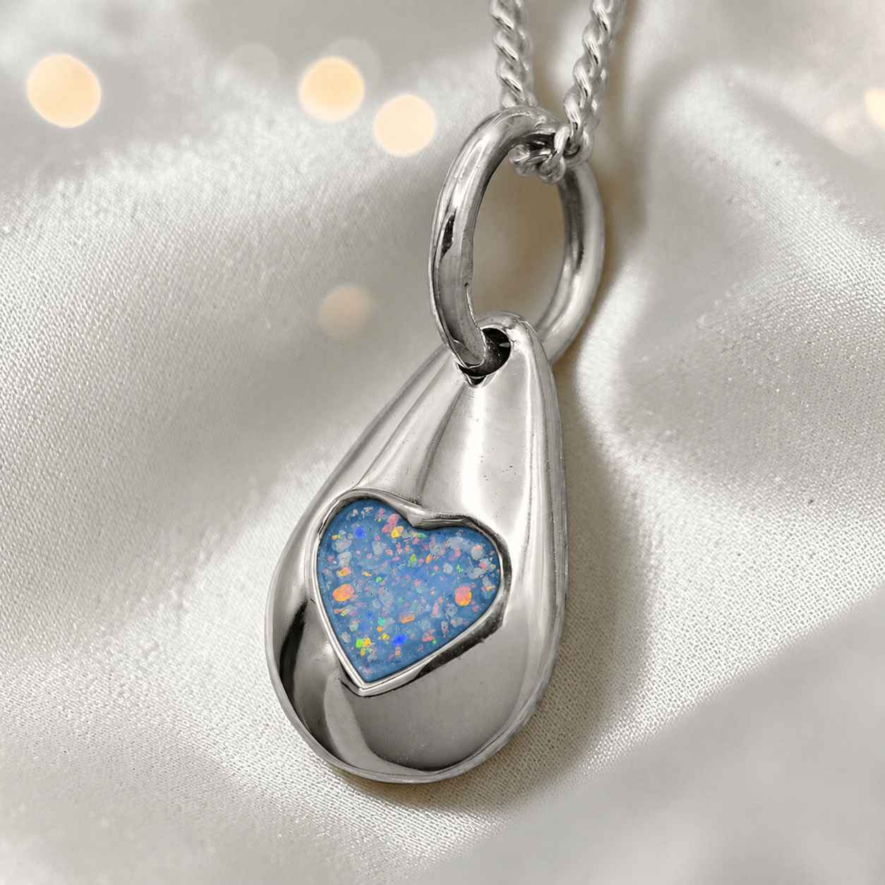 Gacrux pebble shaped pendant with heart memorial stone in baby blue, handcrafted in Lancashire UK - by Keepsake Memorial Jewellery