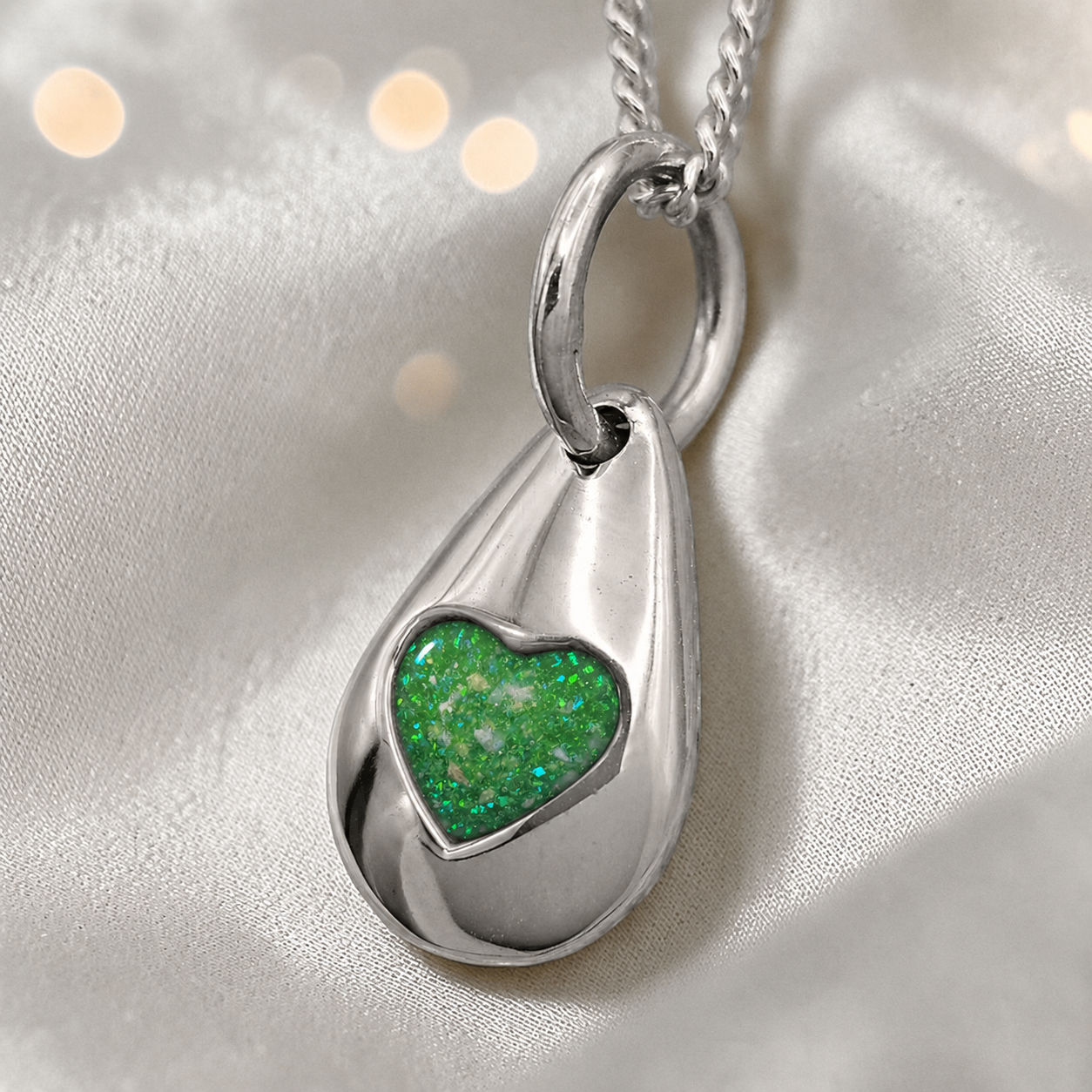 Gacrux pebble shaped pendant with heart memorial stone in fruit green, handcrafted in Lancashire UK - by Keepsake Memorial Jewellery