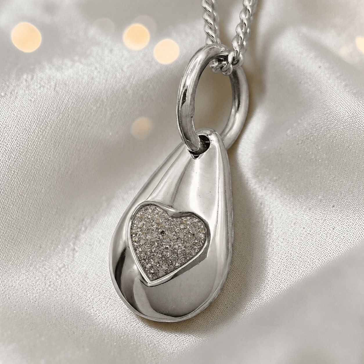 Gacrux pebble shaped pendant with heart memorial stone in natural ash, handcrafted in Lancashire UK - by Keepsake Memorial Jewellery