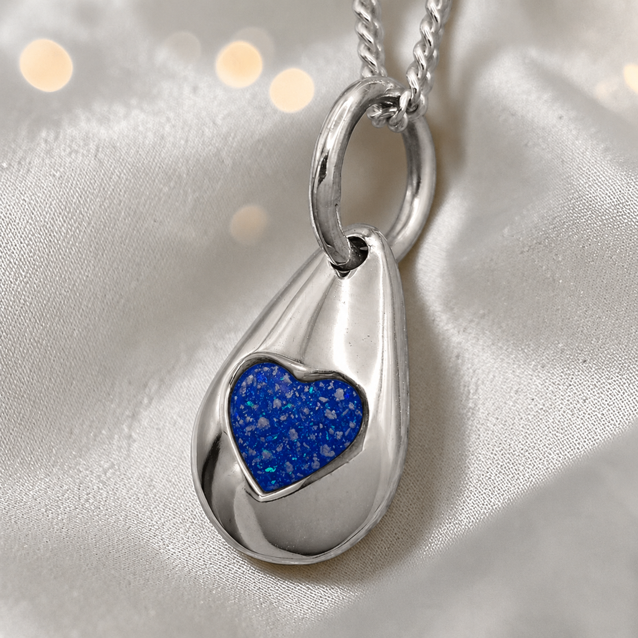 Gacrux pebble shaped pendant with heart memorial stone in royal blue, handcrafted in Lancashire UK - by Keepsake Memorial Jewellery