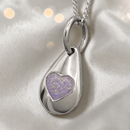 Gacrux pebble shaped pendant with heart memorial stone in unicorn purple, handcrafted in Lancashire UK - by Keepsake Memorial Jewellery