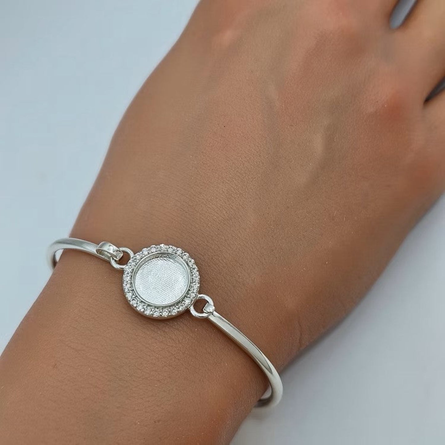 Halo Bangle — silver halo clasp ashes memorial bangle worn on wrist, handcrafted in Lancashire, UK