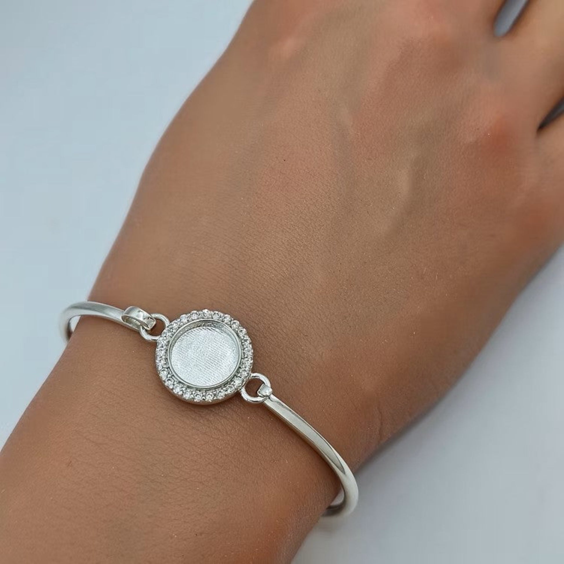 Halo Bangle — silver halo clasp ashes memorial bangle worn on wrist, handcrafted in Lancashire, UK