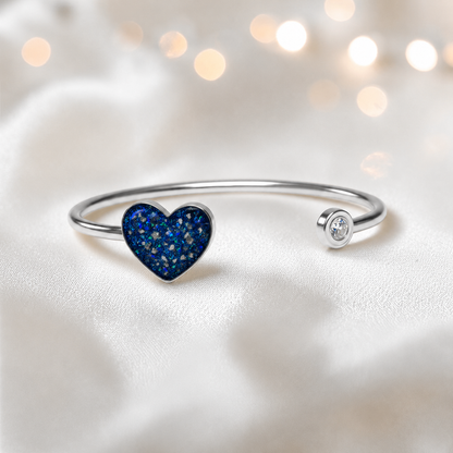 Halcyon Bangle — silver heart ashes memorial bangle in sapphire glow, handcrafted in Lancashire, UK - by Keepsake memorial Jewellery