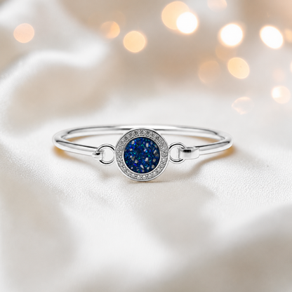 Halo Bangle — silver round CZ ashes memorial bangle in sapphire glow, handcrafted in Lancashire, UK - by Keepsake Memorial Jewellery