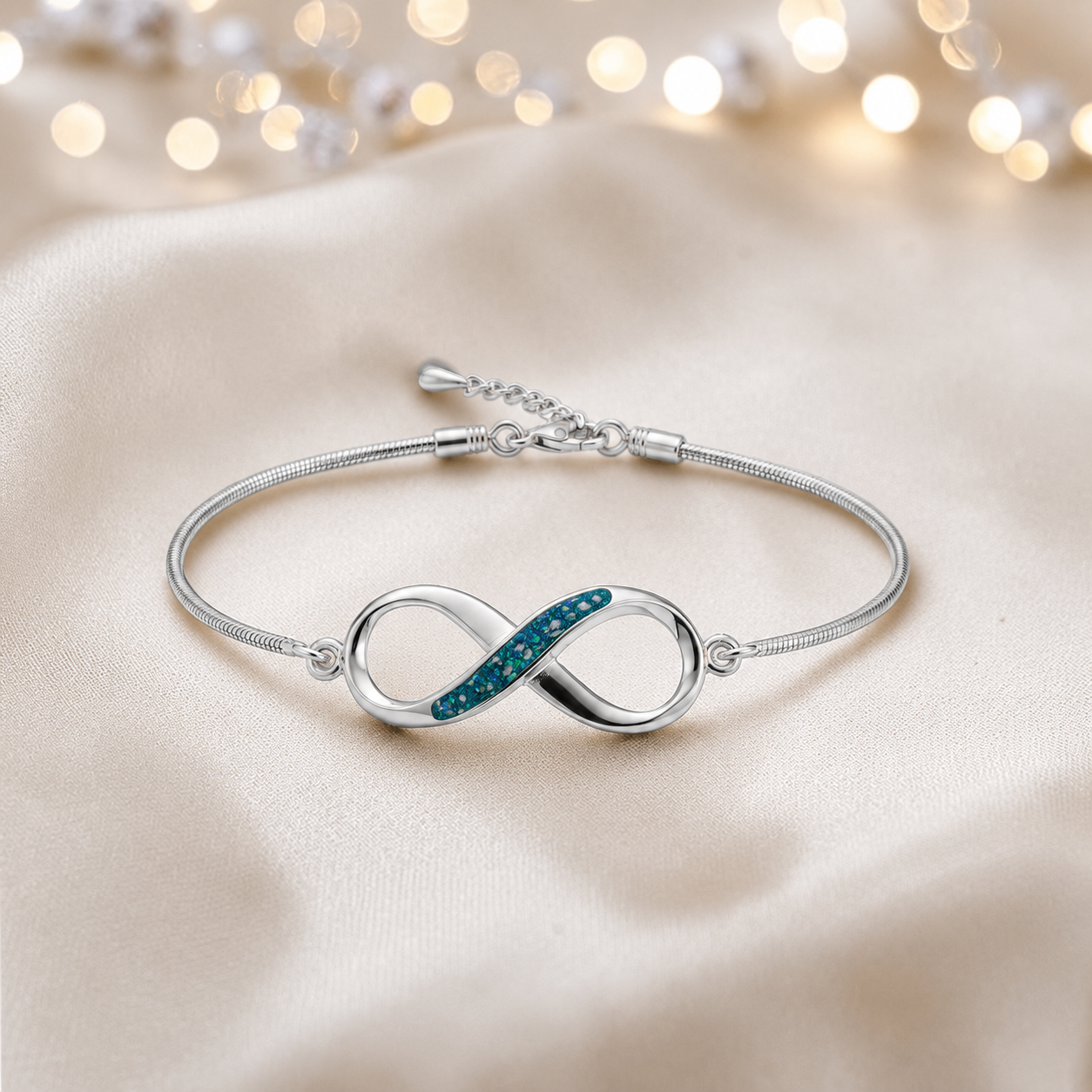 Infinity Bracelet — silver infinity ashes memorial bracelet, in teal mist, handcrafted in Lancashire, UK - by Keepsake Memorial Jewellery 